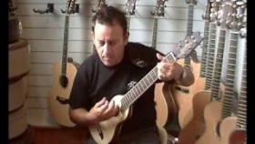 Washburn rover acoustic travel guitar, natural finish strumming